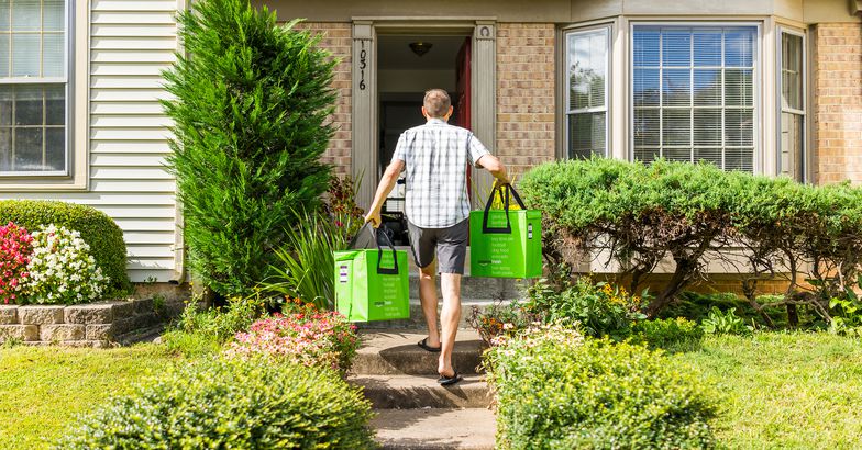 Amazon Fresh insulated grocery delivery bags totes man carrying to front door
