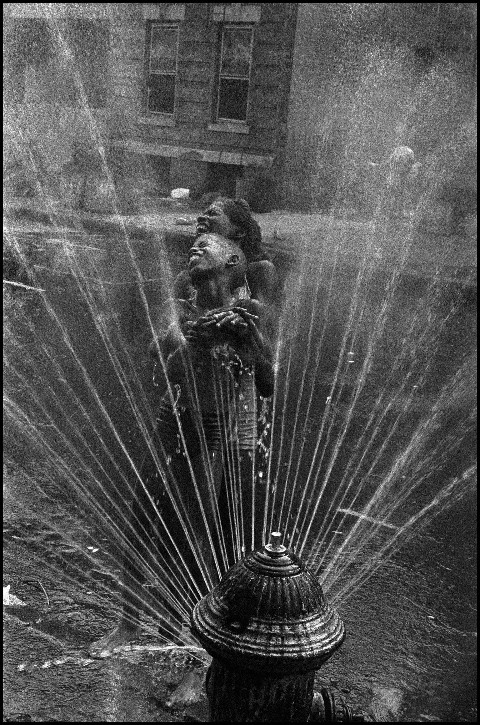 Beating the summer heat with a fire hydrant in Harlem, Manhattan NYC, in 1963 - Leonard Freed photo