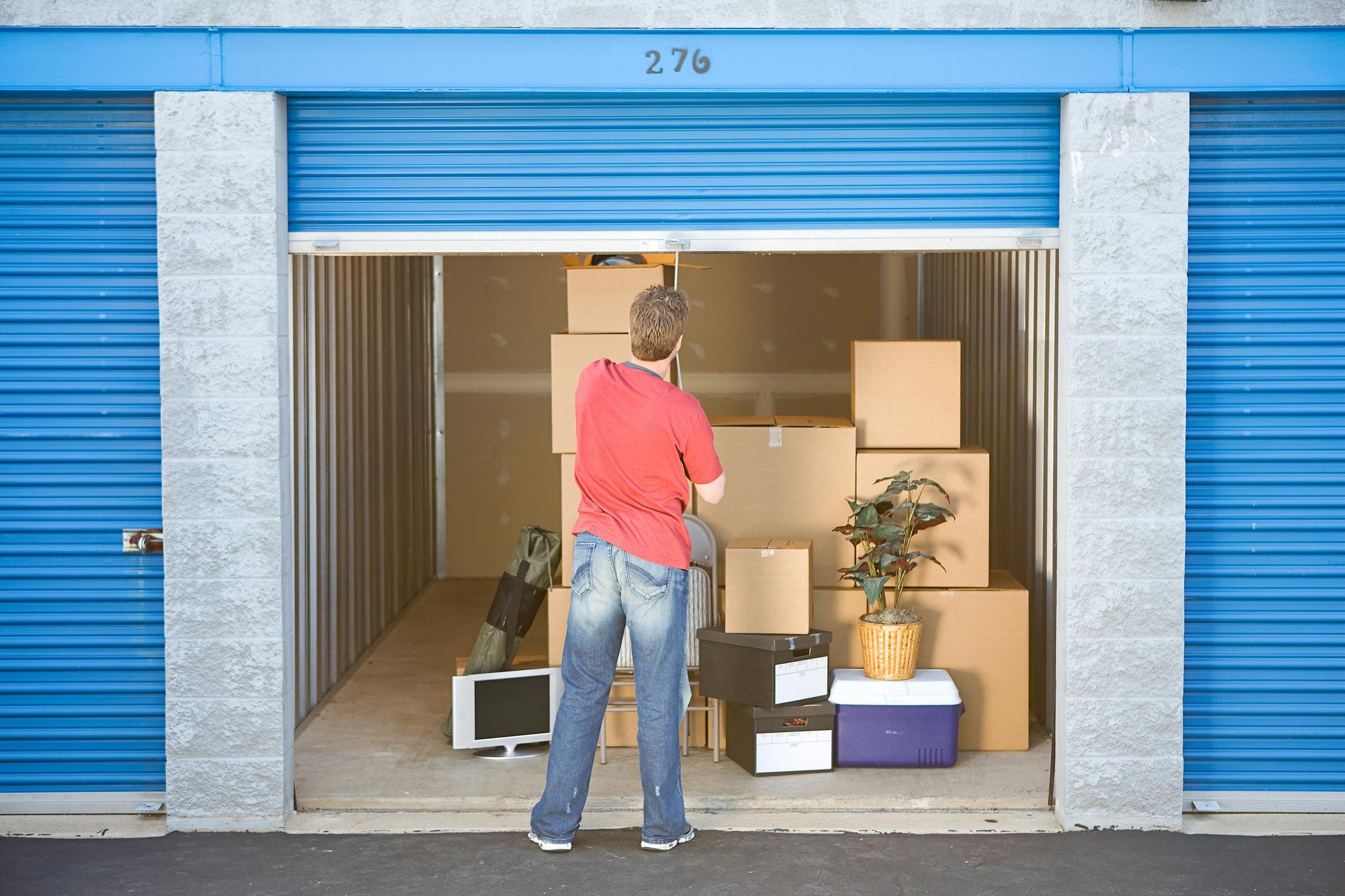man finished putting stuff in storage