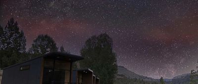 A Row of Tiny Heirloom eXpanses on the Bottom Left in the Mountains At Night, a Huge Starry Sky