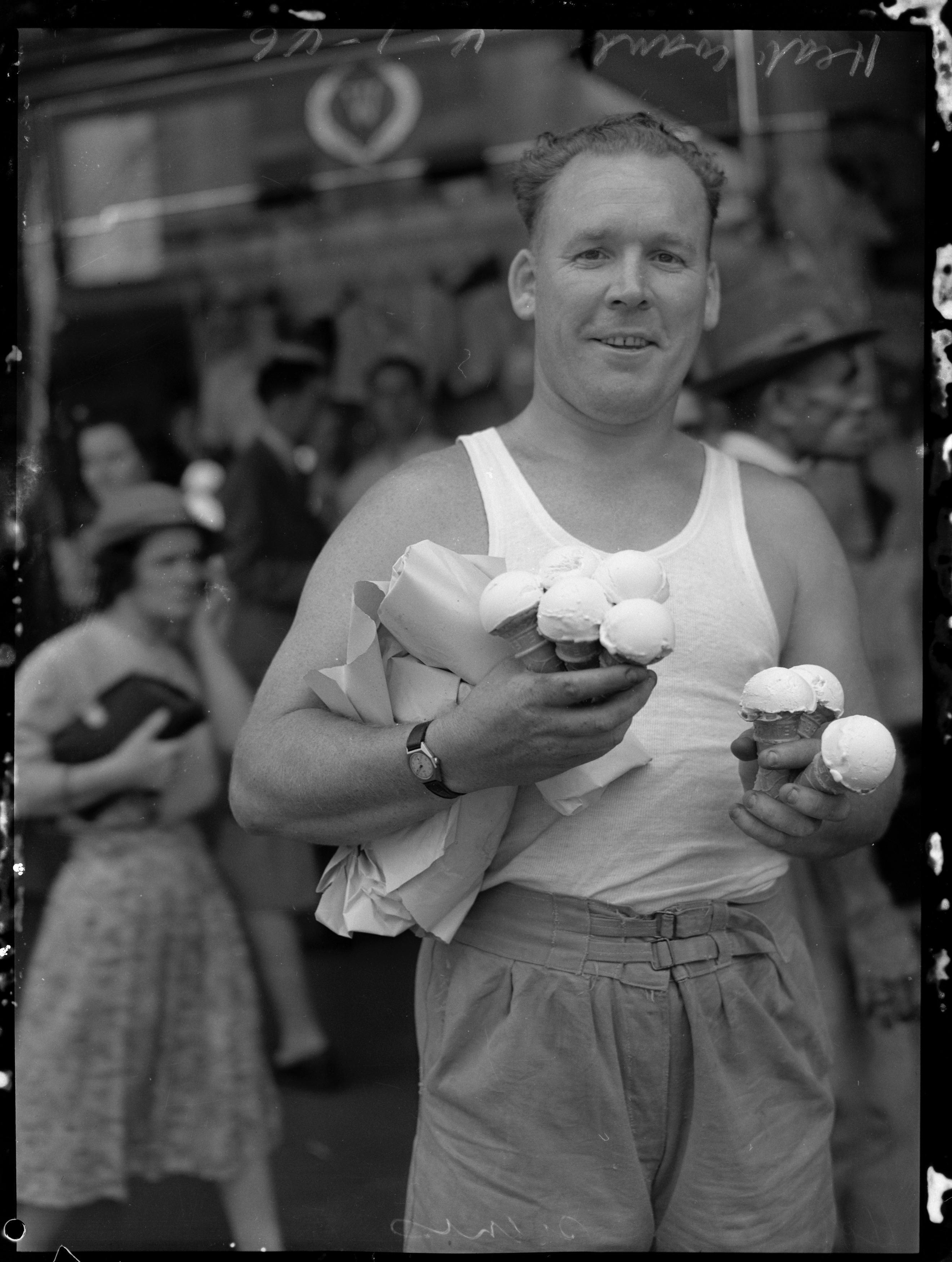 [1946] man with ice cream cones during a heat wave, Sydney, Australia