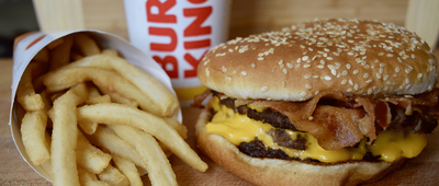 Closeup of Burger King's Triple Stacker King with Fries and a Drink
