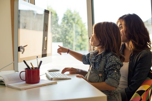 Mom and daughter on computer
