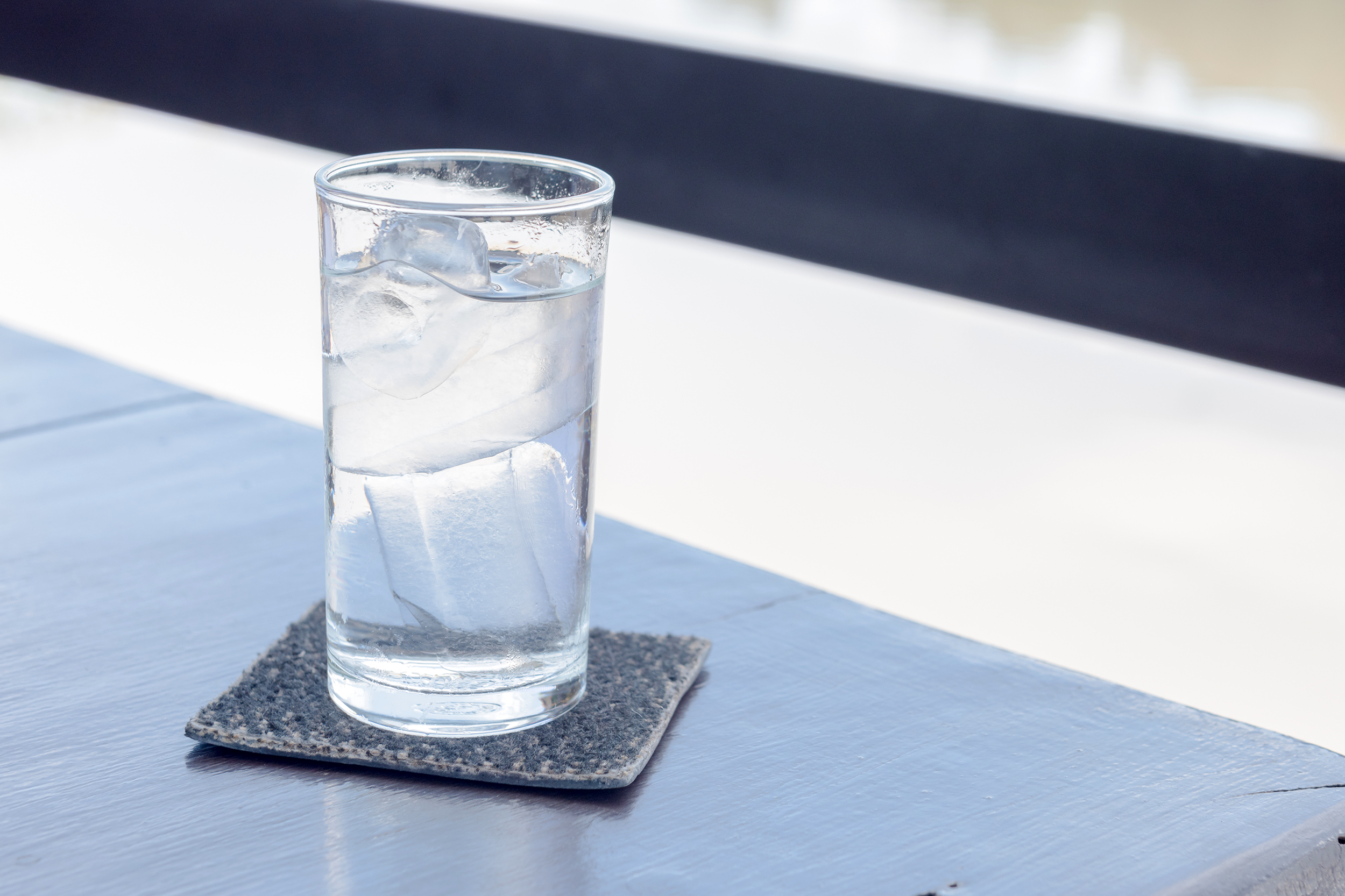 Glass of water with ice on a table