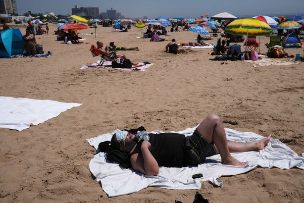 People visit the beach at Coney Island in Brooklyn on July 19, 2020 in New York City