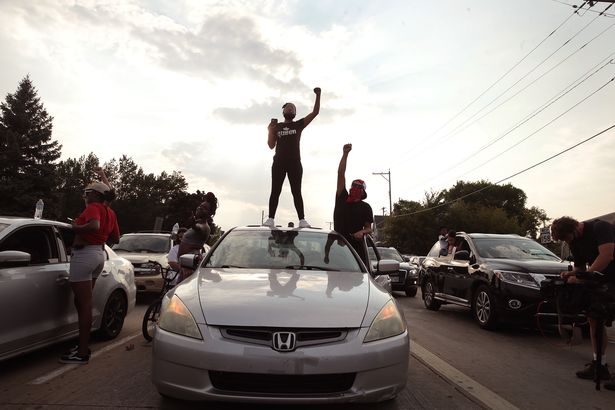 Demonstrators protest in the streets during second night of unrest on August 24, 2020 in Kenosha, Wisconsin