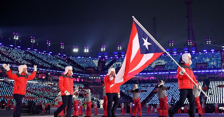flag bearer charles flaherty of puerto rico and teammates arrive at the stadium during the opening ceremony of the pyeongchang 2018 winter olympic games at pyeongchang olympic stadium on february 9, 2018 in pyeongchang-gun, south korea