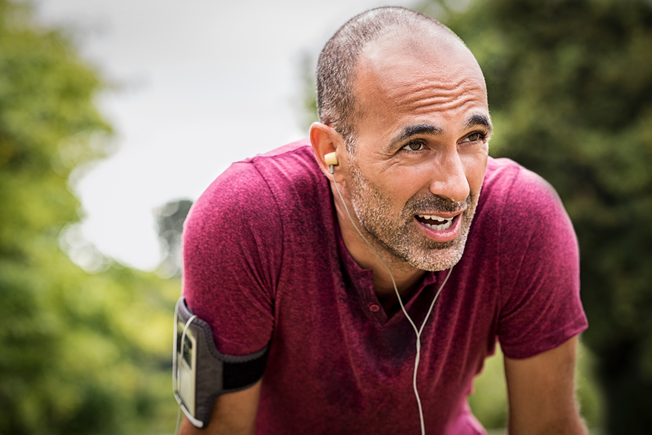 Exhausted man exercising outside