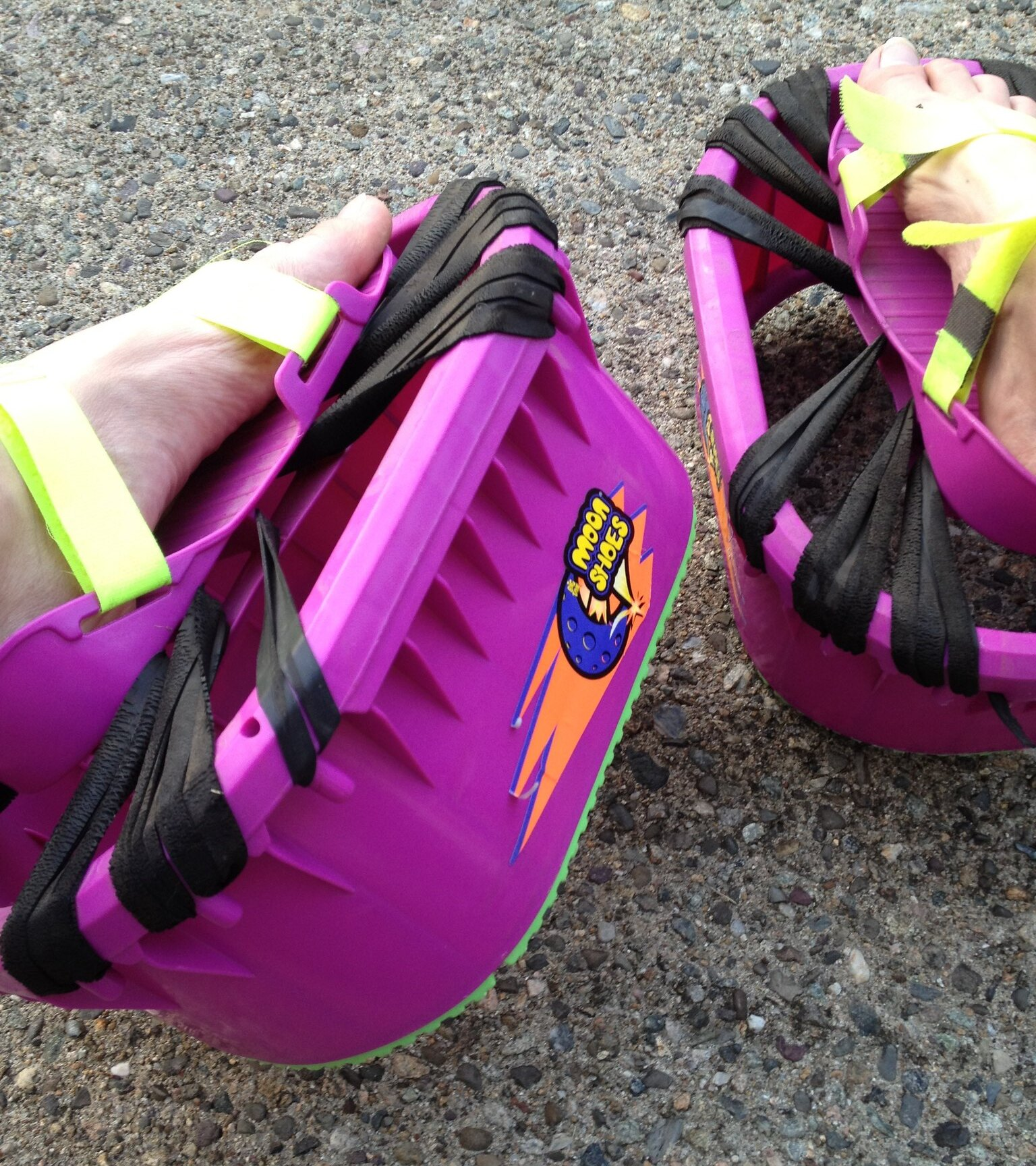 Moon Shoes on Feet of an Adult on Concrete