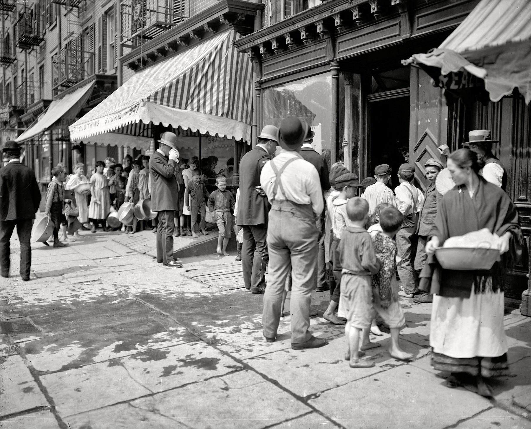 Waiting for free ice during a heat wave in New York City, 1900