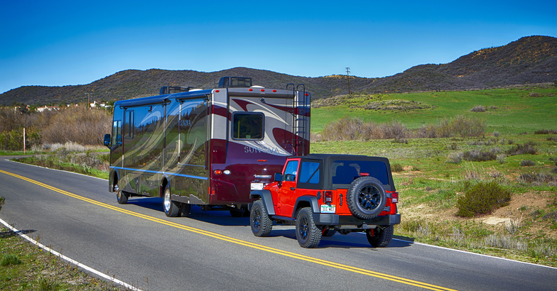RV towing a Jeep