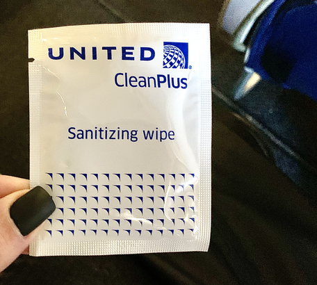 Wonder what it's like to fly during COVID-19? I just did A disinfecting wipe provided by United Airlines