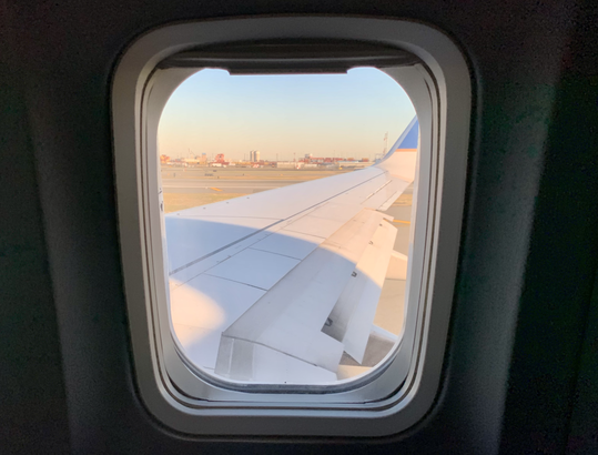 Wonder what it's like to fly during COVID-19? I just did An inside window looking out to a United Airlines airplane