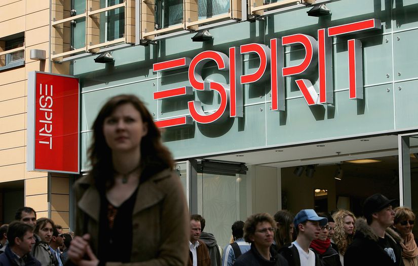 Shoppers Pass an Esprit Clothing Store March 26, 2005 in Munich, Germany, Store Sign Prominent in the Background