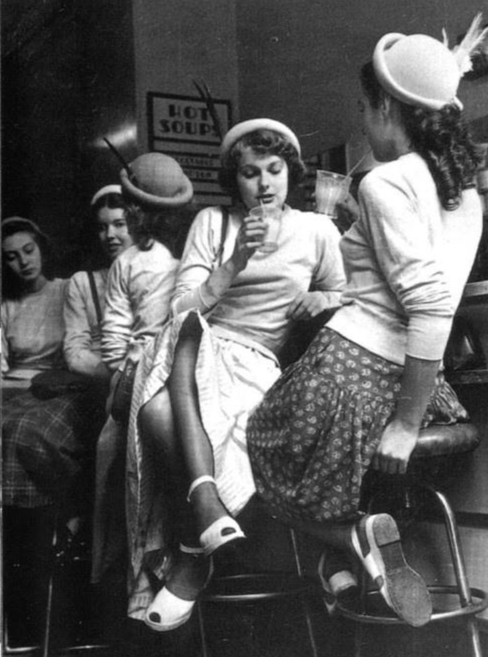 Teenagers at a soda fountain, 1940s