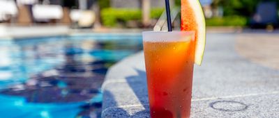 Fresh Watermelon Cocktail on the Ledge of the Swimming Pool at a Resort Hotel