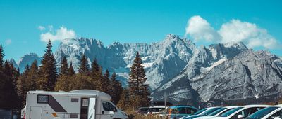 RV parked in front of mountains