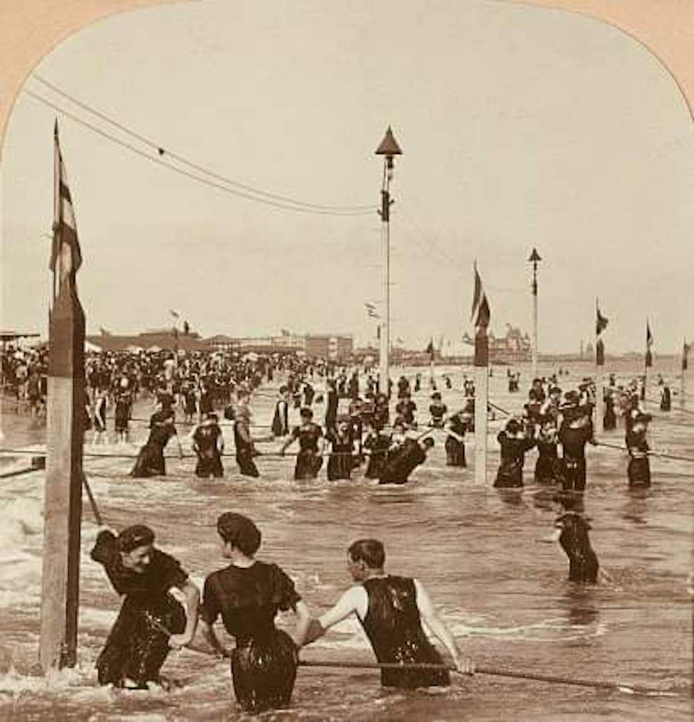 Bathers in the Surf at Coney Island in 1903...The Ropes that some are holding on to were called "Life Lines"