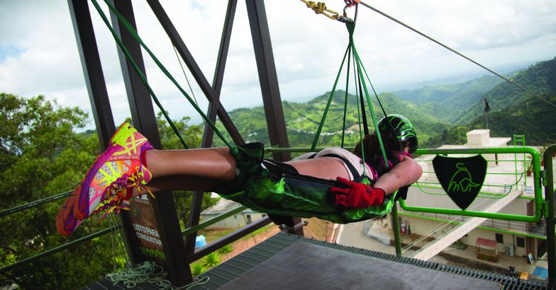woman strapped into el monstruo zipline about to descent