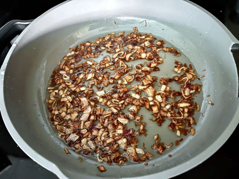shallots frying in a pan