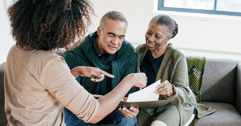 advisor speaking to senior couple