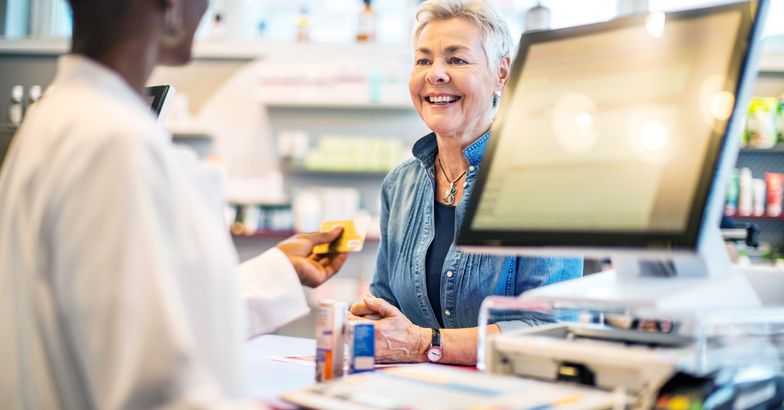 woman checking out at pharmacy