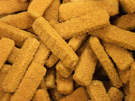 Frozen chicken sticks breaded in the freezer