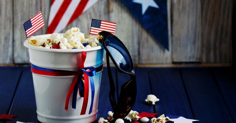 popcorn in bucket with patriotic decorations, sunglasses