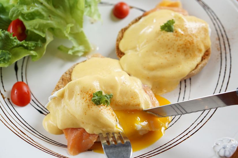 Egg Benedict - Poached egg with smoked salmon on toasted with fresh hollandaise sauce, Delicious homemade breakfast.