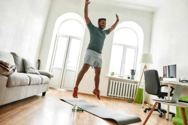 man jumping workout home
