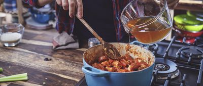 Preparing Cajun Style Chicken, Shrimp and Sausage Jambalaya in a Cast Iron Pot