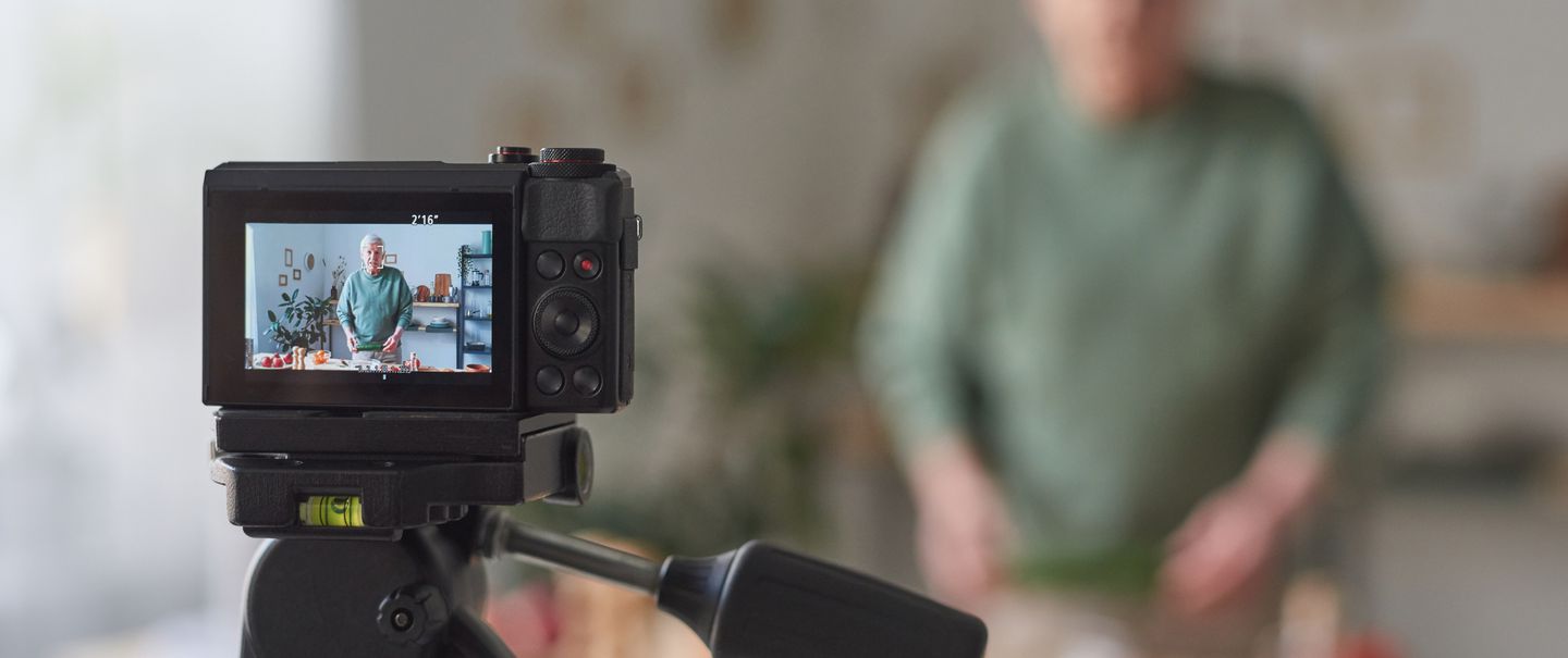 Food blogger using camera at work