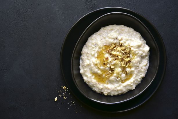 Oat porridge with nuts and maple syrup for a breakfast
