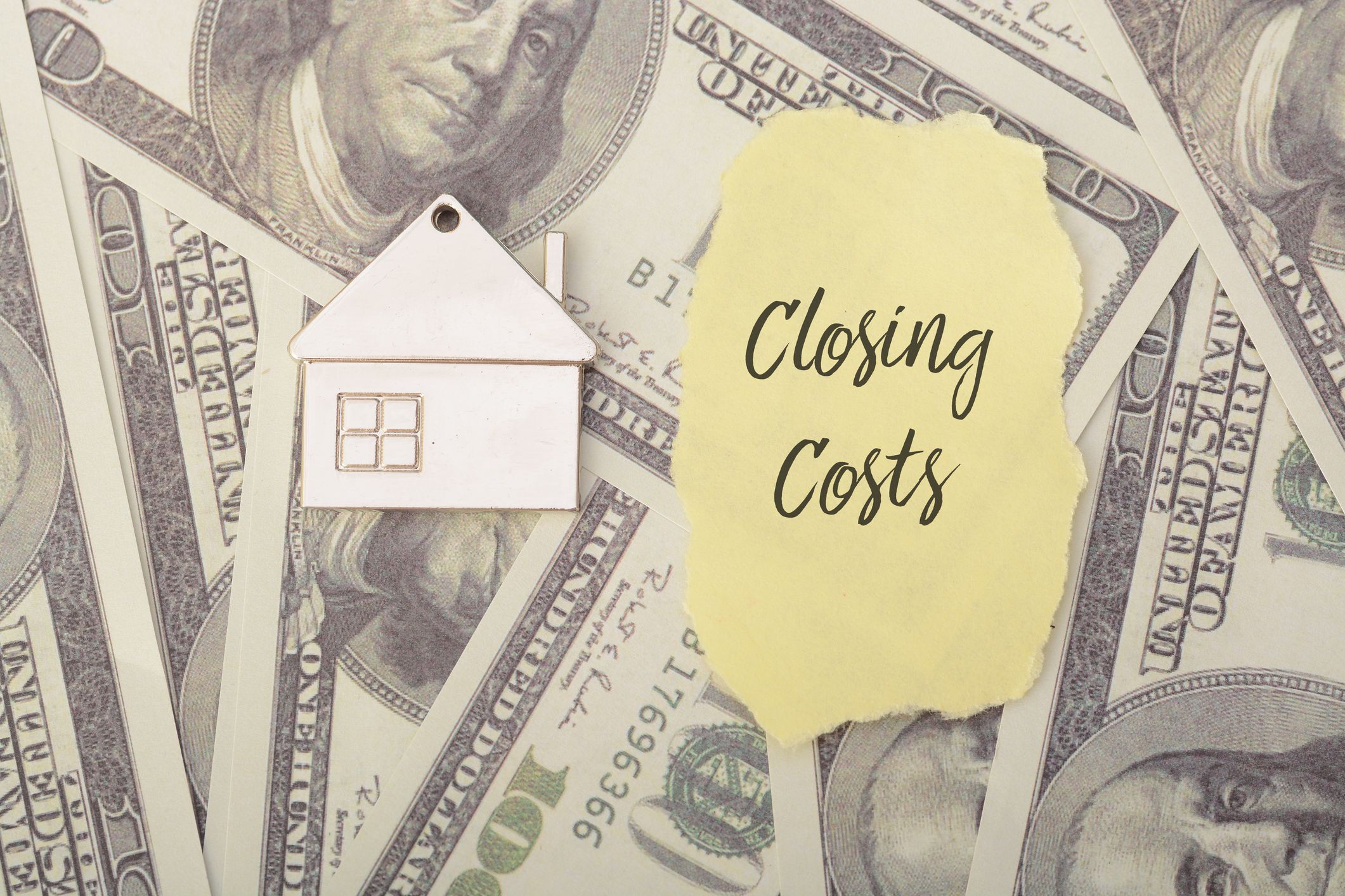 Closing costs are the various fees and expenses associated with the purchase or sale of real estate, typically incurred at the closing or settlement of a real estate transaction
