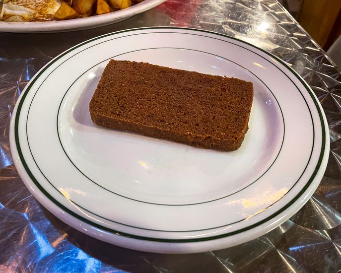 Philadelphia, PA  US  Oct 14, 2023  Plate of Scrapple an ethnic food of the Pennsylvania Dutch. A mush of pork scraps and trimmings combined with cornmeal and wheat flour.