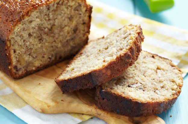 Sliced banana bread on a wooden cutting board