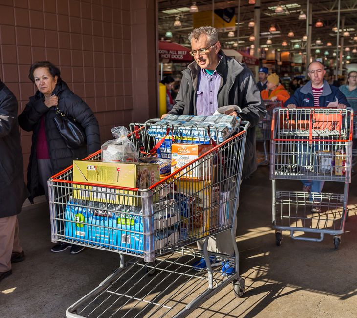 People with shopping carts fill