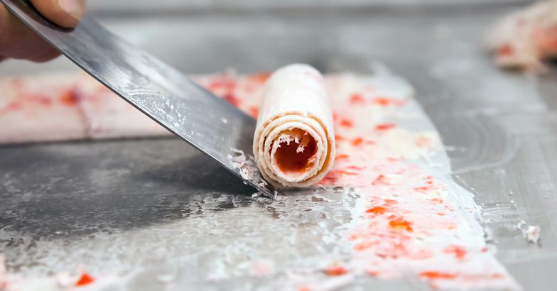 detail of strawberry rolled ice cream on cold plate