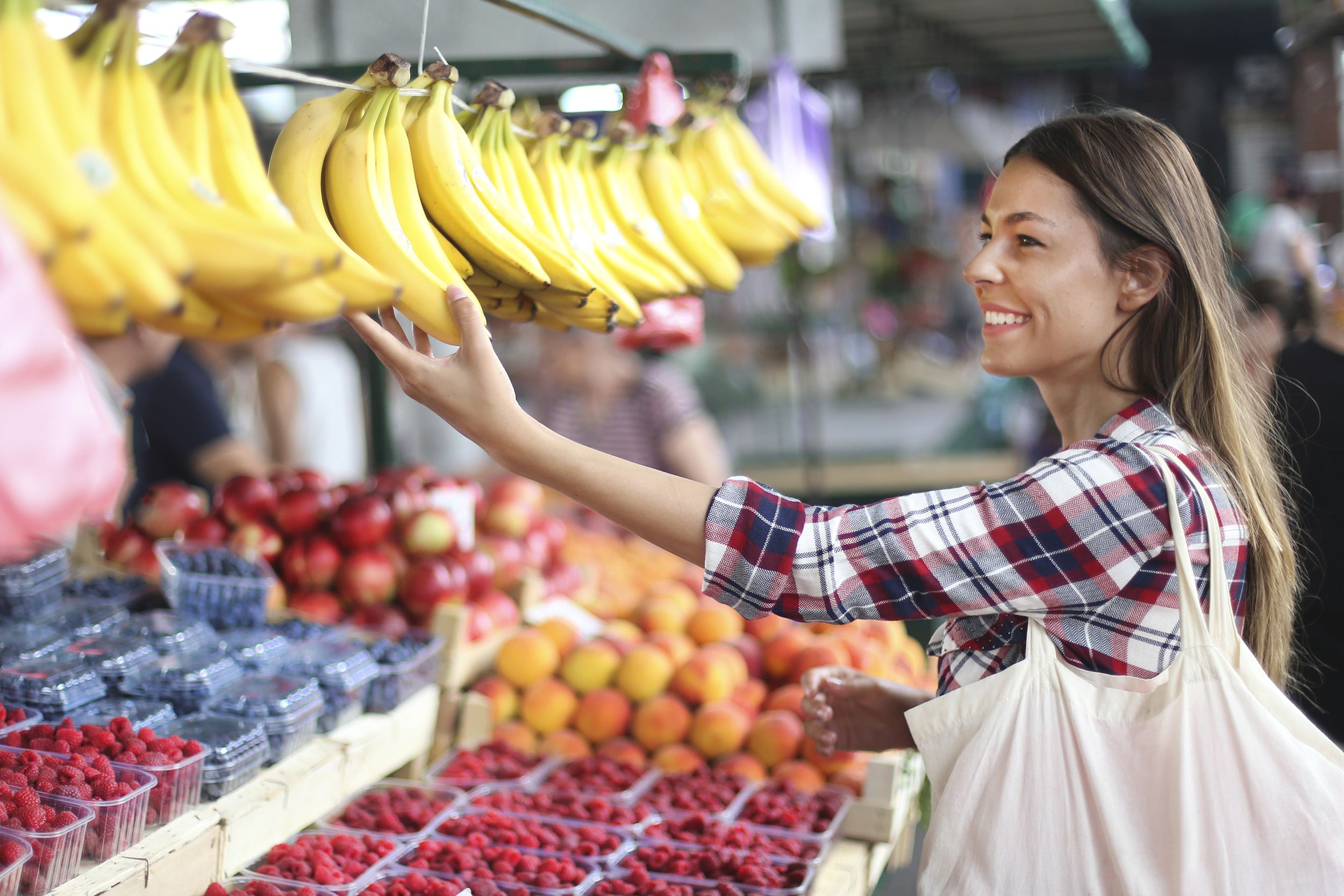 woman choosing bananas