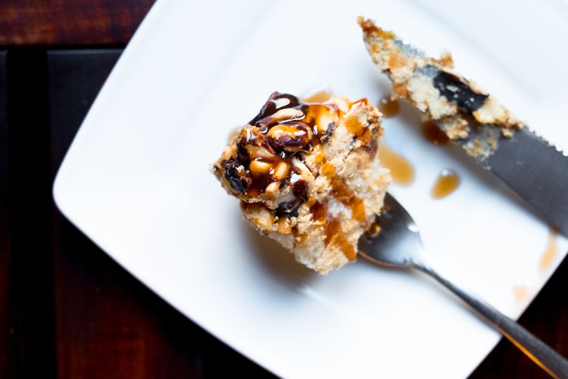 Cake with walnuts and honey on plate. Top view.