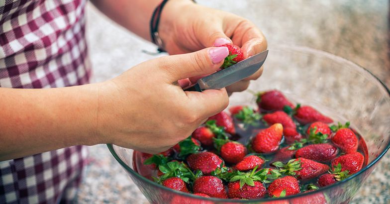 cutting and soaking strawberries