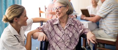 Happy senior woman in nursing home