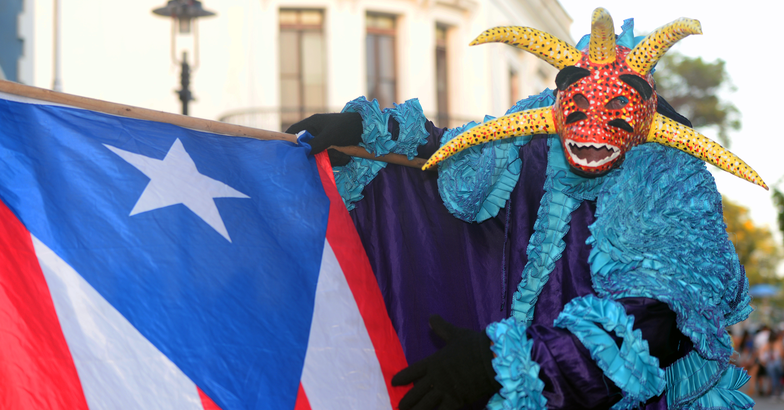 carnival vejigante with puerto rican flag